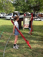 Children trying their hand at stilt walking.