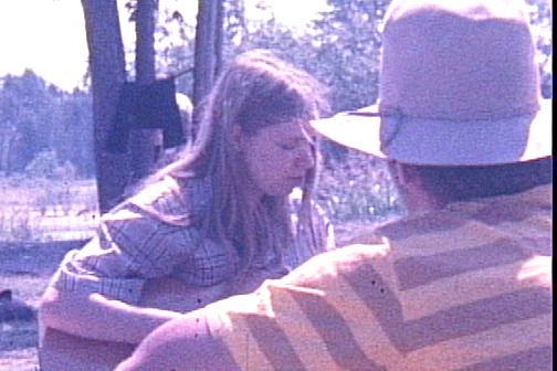 Guitarist at campsite - Copyright Charles Burwell